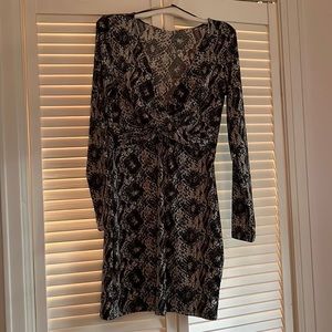 Brand new snake print long sleeve dress.